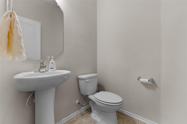 11212 Haviture Way, Waco, TX 76708 - bathroom featuring toilet, tile patterned flooring, and baseboards