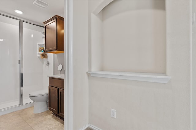 11212 Haviture Way, Waco, TX 76708 - full bathroom featuring a shower stall, toilet, vanity, and tile patterned floors