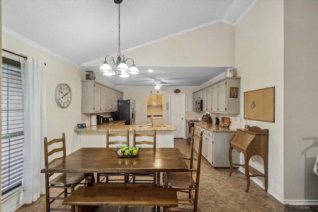 221 Country View Ln, Crandall, TX 75114 - dining space with lofted ceiling, a chandelier, ceiling fan, dark tile patterned flooring, and crown molding