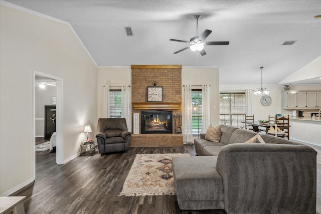 221 Country View Ln, Crandall, TX 75114 - living area with lofted ceiling, ceiling fan, a brick fireplace, dark wood finished floors, and baseboards