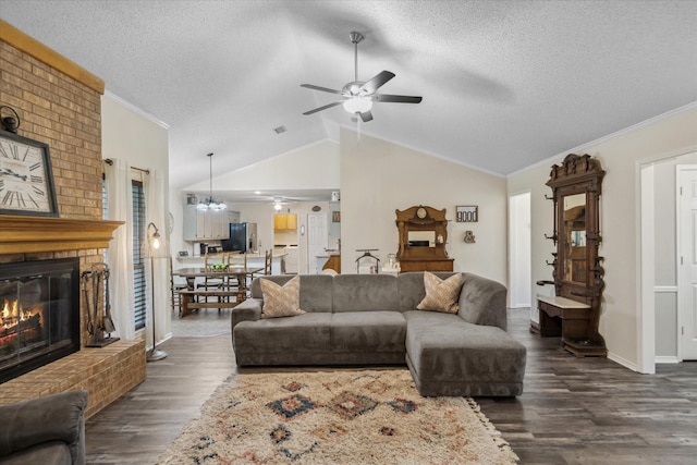 221 Country View Ln, Crandall, TX 75114 - living room with a ceiling fan, dark wood-style floors, a brick fireplace, vaulted ceiling, and ornamental molding