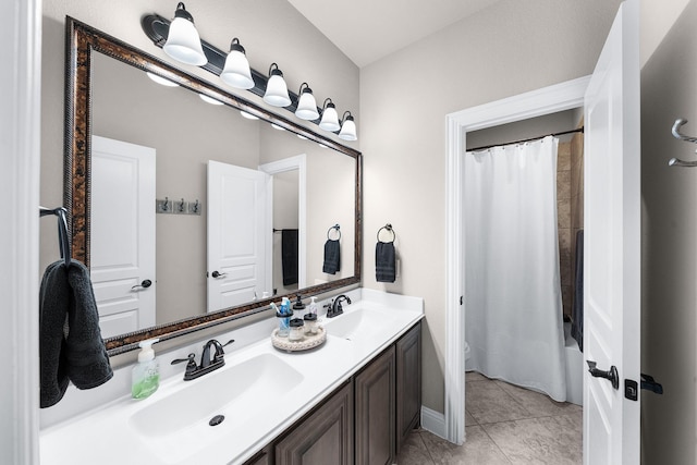 4705 Stillhouse Hollow Ln, Argyle, TX 76226 - full bathroom with double vanity, shower / tub combo with curtain, tile patterned flooring, and baseboards