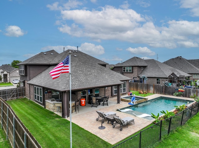 4705 Stillhouse Hollow Ln, Argyle, TX 76226 - view of pool featuring a patio area, an outdoor kitchen, a pool with connected hot tub, and a residential view