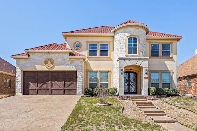 3413 De Vinci Dr, Plano, TX 75074 - mediterranean / spanish home featuring a tiled roof, driveway, stucco siding, an attached garage, and stone siding