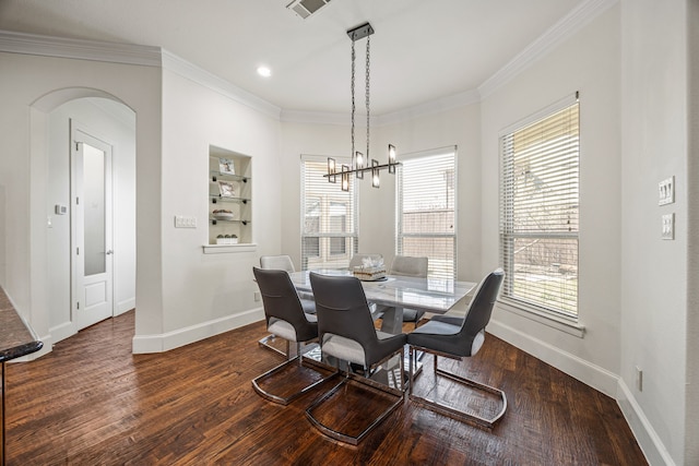 3413 De Vinci Dr, Plano, TX 75074 - dining area featuring baseboards, a chandelier, ornamental molding, wood finished floors, and plenty of natural light