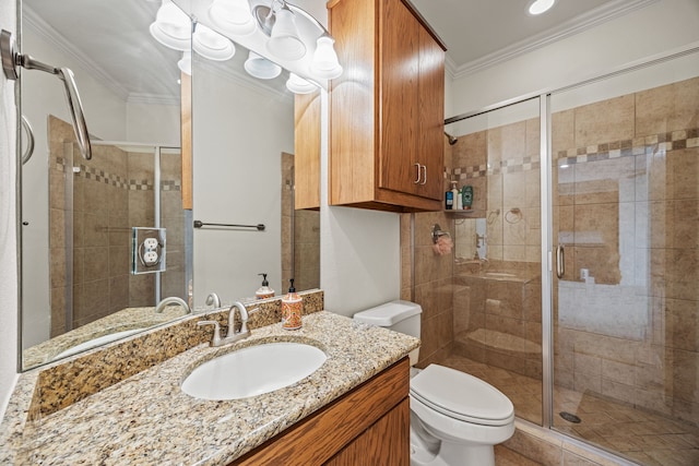3413 De Vinci Dr, Plano, TX 75074 - bathroom featuring ornamental molding, toilet, vanity, and a stall shower