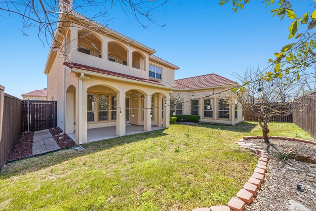 3413 De Vinci Dr, Plano, TX 75074 - back of house featuring a balcony, a patio, stucco siding, and a tiled roof