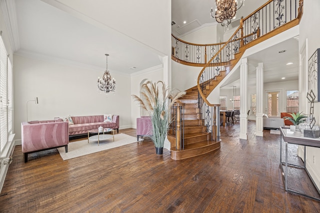 3413 De Vinci Dr, Plano, TX 75074 - foyer featuring a chandelier, stairway, wood finished floors, crown molding, and a towering ceiling
