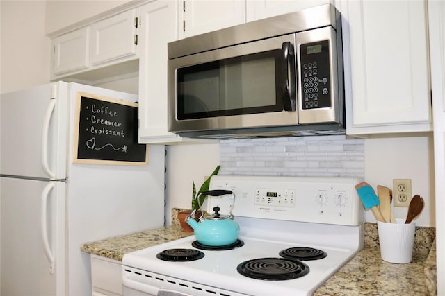 5616 Preston Oaks Rd Unit 508, Dallas, TX 75254 - kitchen with white appliances, white cabinets, tasteful backsplash, and light stone countertops