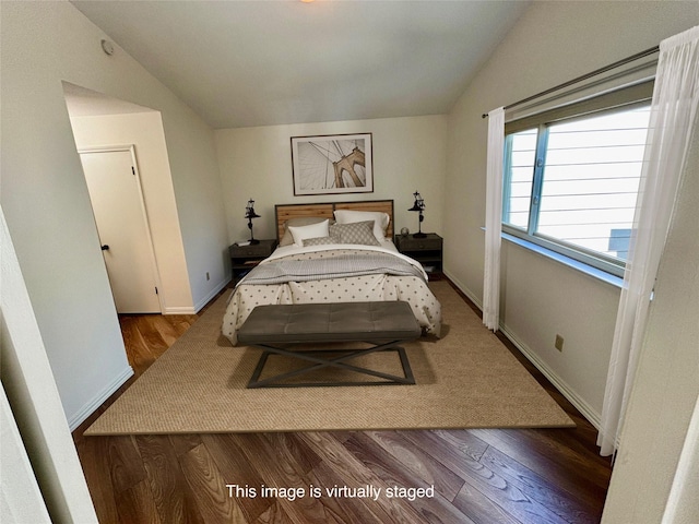 5616 Preston Oaks Rd Unit 508, Dallas, TX 75254 - bedroom featuring vaulted ceiling, wood finished floors, and baseboards