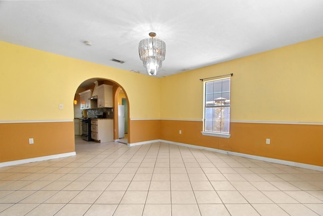 3829 Willing Ave, Fort Worth, TX 76110 - spare room featuring arched walkways, baseboards, a chandelier, and a smoke detector