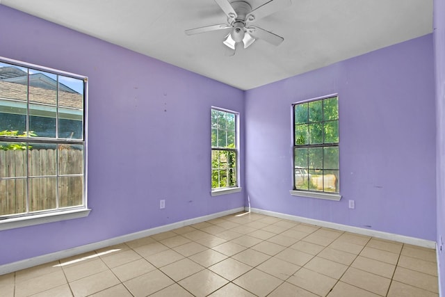 3829 Willing Ave, Fort Worth, TX 76110 - unfurnished room featuring baseboards, a ceiling fan, and light tile patterned floors