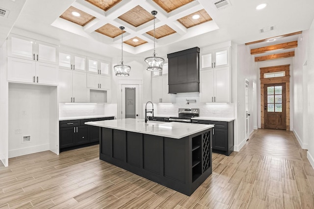 3008 25th St, Fort Worth, TX 76106 - kitchen with stainless steel electric range oven, a sink, baseboards, beam ceiling, and light countertops