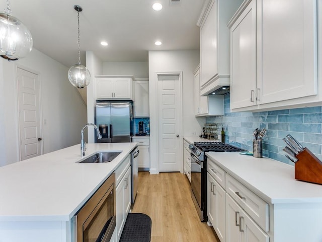 6656 Windfall Dr, Fort Worth, TX 76135 - kitchen featuring stainless steel appliances, a sink, recessed lighting, white cabinetry, and light countertops