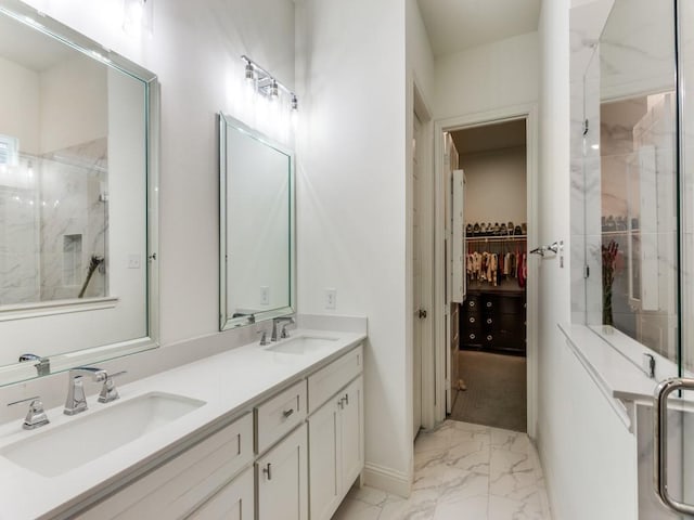 6656 Windfall Dr, Fort Worth, TX 76135 - full bath featuring marble finish flooring, a marble finish shower, double vanity, a walk in closet, and baseboards