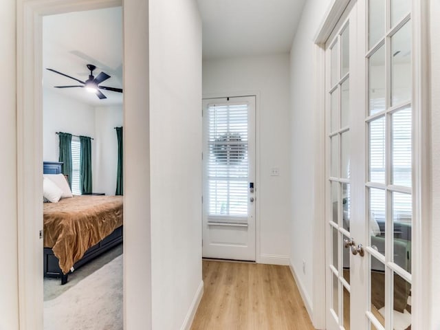 6656 Windfall Dr, Fort Worth, TX 76135 - hall with healthy amount of natural light, french doors, baseboards, and light wood-type flooring