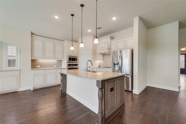 1207 Glasbury Glen Way, Forney, TX 75126 - kitchen with appliances with stainless steel finishes, a sink, an island with sink, backsplash, and dark wood-type flooring