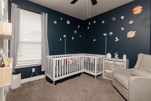 1225 Lynn Dr, Arlington, TX 76002 - carpeted bedroom with a nursery area and ceiling fan