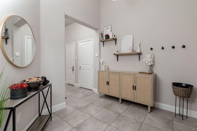 1225 Lynn Dr, Arlington, TX 76002 - corridor featuring light tile patterned floors and baseboards