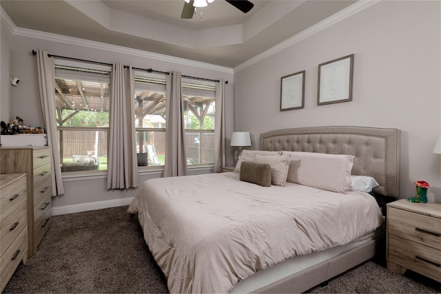 1225 Lynn Dr, Arlington, TX 76002 - bedroom with a tray ceiling, dark carpet, multiple windows, ceiling fan, and ornamental molding