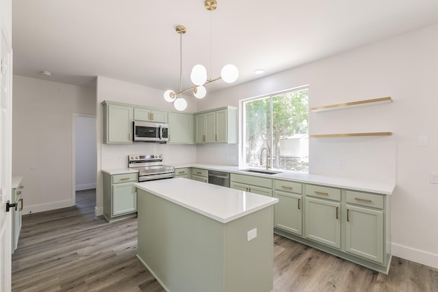 7205 Coventry Cir, North Richland Hills, TX 76182 - kitchen featuring stainless steel appliances, green cabinets, a sink, and light countertops