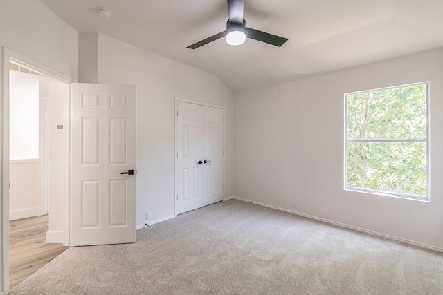 7205 Coventry Cir, North Richland Hills, TX 76182 - unfurnished bedroom with vaulted ceiling, carpet, baseboards, a ceiling fan, and a closet