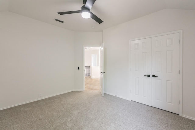 7205 Coventry Cir, North Richland Hills, TX 76182 - unfurnished bedroom featuring light carpet, lofted ceiling, a closet, a ceiling fan, and baseboards
