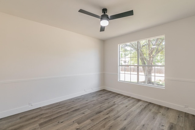 7205 Coventry Cir, North Richland Hills, TX 76182 - empty room featuring wood finished floors, baseboards, and a ceiling fan