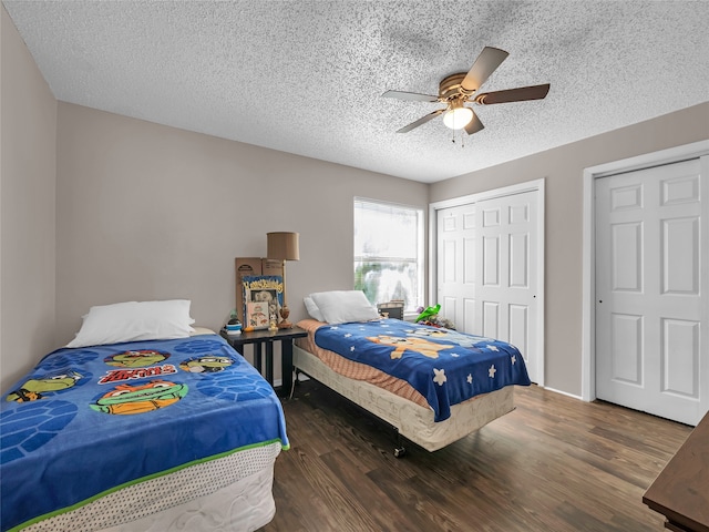 9170 Forest Ln Unit 228, Dallas, TX 75243 - bedroom featuring wood finished floors, a closet, a ceiling fan, and a textured ceiling