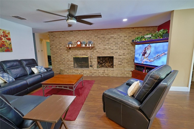312 W Pleasantview Dr, Hurst, TX 76054 - living room featuring brick wall, a ceiling fan, wood finished floors, recessed lighting, and a brick fireplace