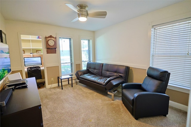 312 W Pleasantview Dr, Hurst, TX 76054 - living room featuring an office area, light carpet, ceiling fan, and baseboards
