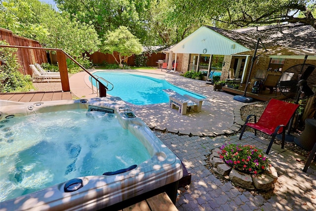 312 W Pleasantview Dr, Hurst, TX 76054 - view of swimming pool with an outdoor hot tub, a patio area, and a fenced backyard