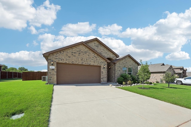 632 Dunster Ln, Saginaw, TX 76131 - view of front of house featuring brick siding, driveway, cooling unit, and an attached garage