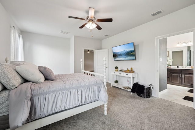 632 Dunster Ln, Saginaw, TX 76131 - bedroom with light carpet, ensuite bathroom, a ceiling fan, baseboards, and a sink