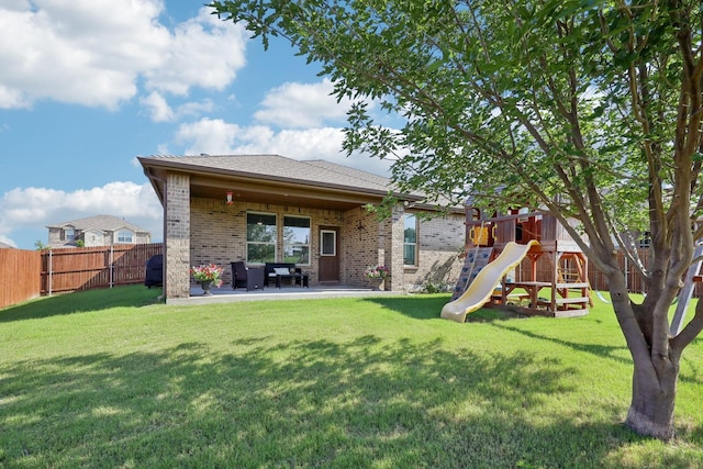 632 Dunster Ln, Saginaw, TX 76131 - back of property featuring brick siding, a playground, and a patio