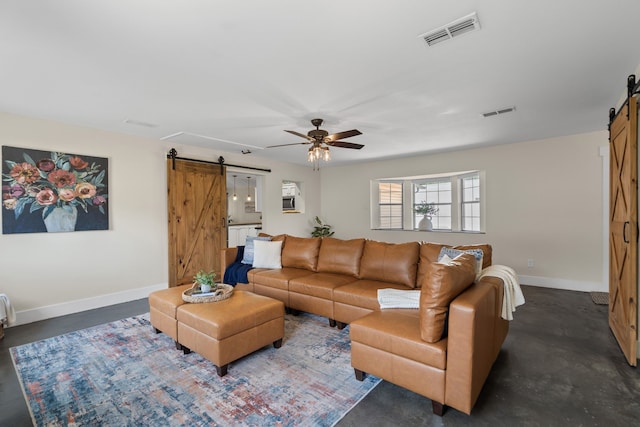 1418 Lakeshore Blvd, Oak Point, TX 75068 - living room featuring a barn door, concrete floors, ceiling fan, and baseboards