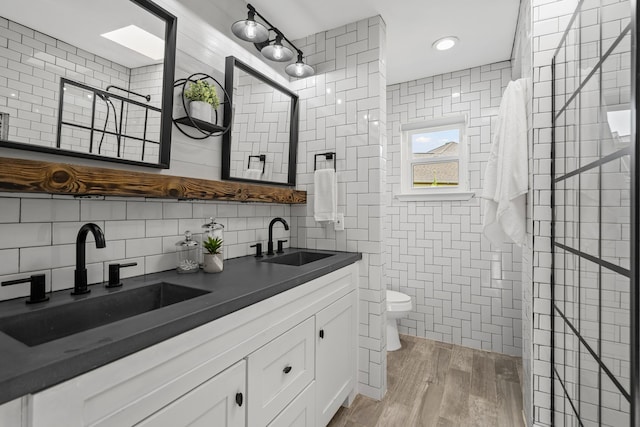 1418 Lakeshore Blvd, Oak Point, TX 75068 - bathroom featuring tile walls, toilet, a walk in shower, double vanity, and backsplash