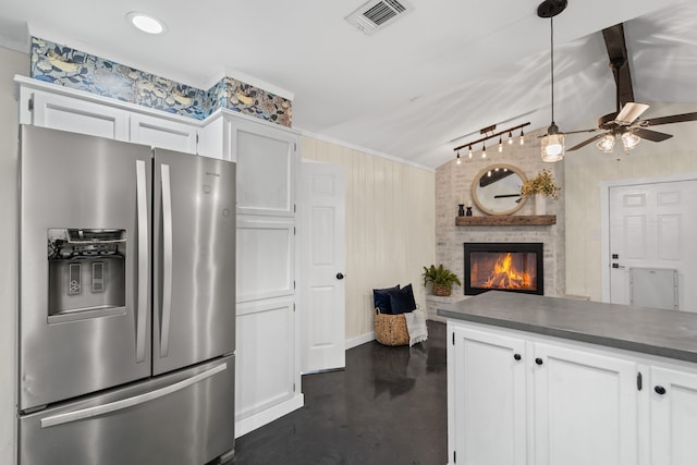 1418 Lakeshore Blvd, Oak Point, TX 75068 - kitchen with stainless steel fridge, dark countertops, lofted ceiling, ceiling fan, and white cabinets