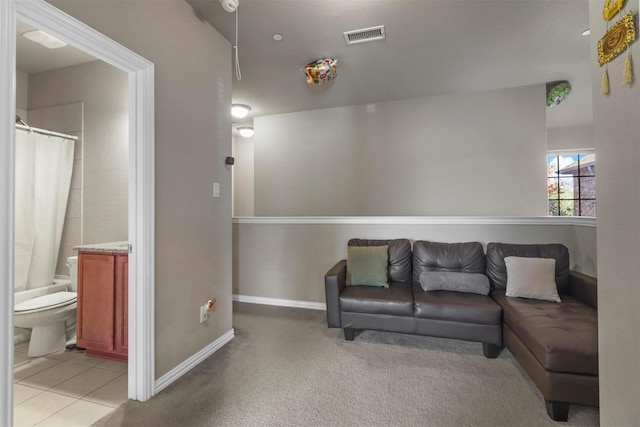 316 Tallgrass Ln, Plano, TX 75023 - living area featuring baseboards, light tile patterned floors, and light colored carpet