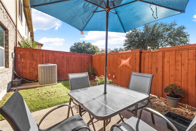 316 Tallgrass Ln, Plano, TX 75023 - fenced backyard featuring central air condition unit and outdoor dining space