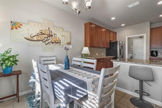 316 Tallgrass Ln, Plano, TX 75023 - dining room with a chandelier, light tile patterned floors, recessed lighting, and baseboards