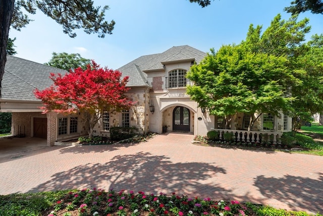 842 Bluff Ridge Dr, Cedar Hill, TX 75104 - view of front of house featuring french doors, stone siding, an attached garage, and decorative driveway