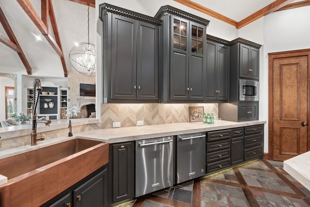 842 Bluff Ridge Dr, Cedar Hill, TX 75104 - kitchen featuring appliances with stainless steel finishes, inlaid floor details, a sink, a chandelier, and glass insert cabinets