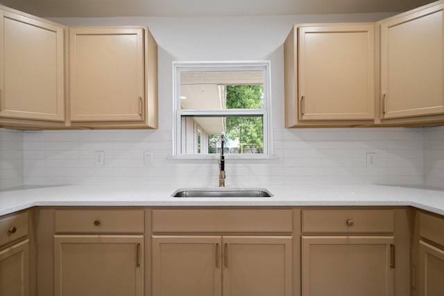 6625 Bridges Ave, Richland Hills, TX 76118 - kitchen featuring a sink, backsplash, and light countertops