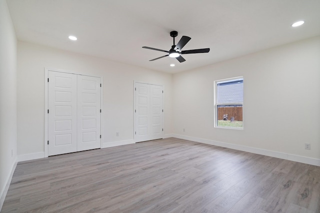 6625 Bridges Ave, Richland Hills, TX 76118 - unfurnished bedroom featuring light wood-style flooring, recessed lighting, baseboards, multiple closets, and ceiling fan