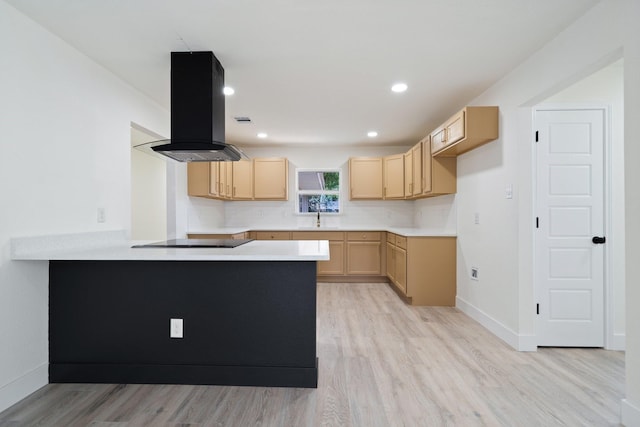 6625 Bridges Ave, Richland Hills, TX 76118 - kitchen featuring wall chimney exhaust hood, light brown cabinets, a peninsula, light wood-style flooring, and black electric cooktop