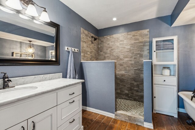 5906 Gregory Ln, Parker, TX 75002 - full bath with walk in shower, wood finished floors, vanity, and a freestanding bath
