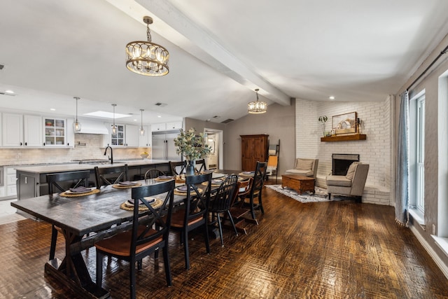 5906 Gregory Ln, Parker, TX 75002 - dining space featuring a chandelier, a fireplace, dark wood-style floors, and recessed lighting