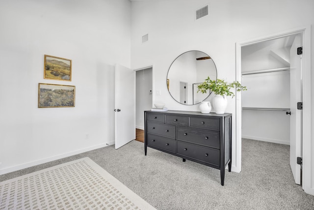 5806 Bryan Pkwy Unit 4, Dallas, TX 75206 - carpeted bedroom featuring a spacious closet, baseboards, a towering ceiling, and a closet