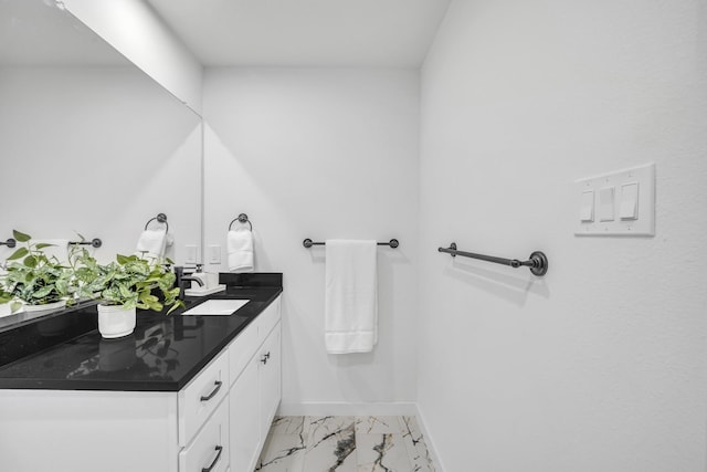 5806 Bryan Pkwy Unit 4, Dallas, TX 75206 - bathroom with baseboards, double vanity, and marble finish floors